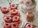 Beauty shot of Molly Yeh's Sprinkle-y Glazed Yeasted Donuts, as seen on Girl Meets Farm, season 10.