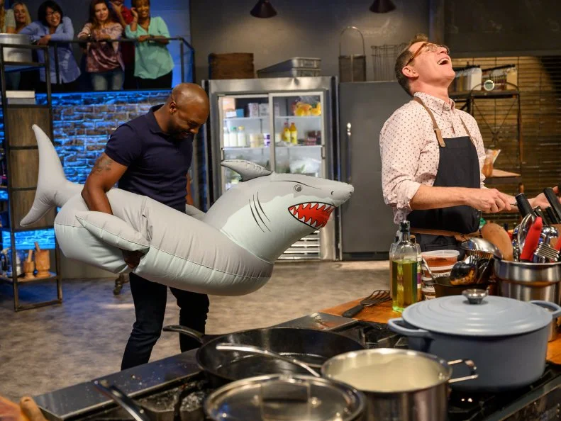Co-Host Eddie Jackson tries to distract Bobby Flay, as seen on Beat Bobby Flay, Season 29.