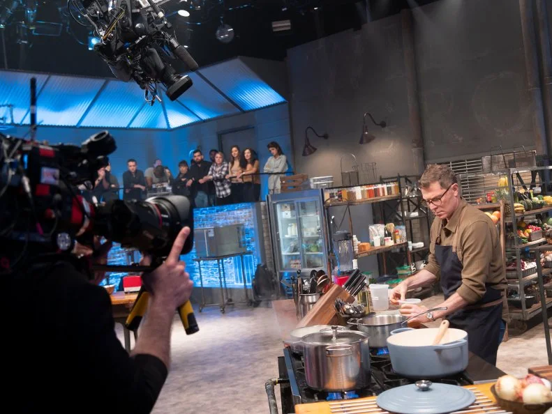 Host Bobby Flay races to finish his crab bisque dish, as seen on Beat Bobby Flay, Season 25.
