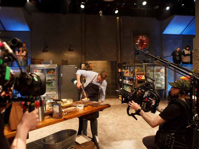Behind the scenes of Bobby Flay using a blowtorch to brown his dish, as seen on Beat Bobby Flay, Season 22.