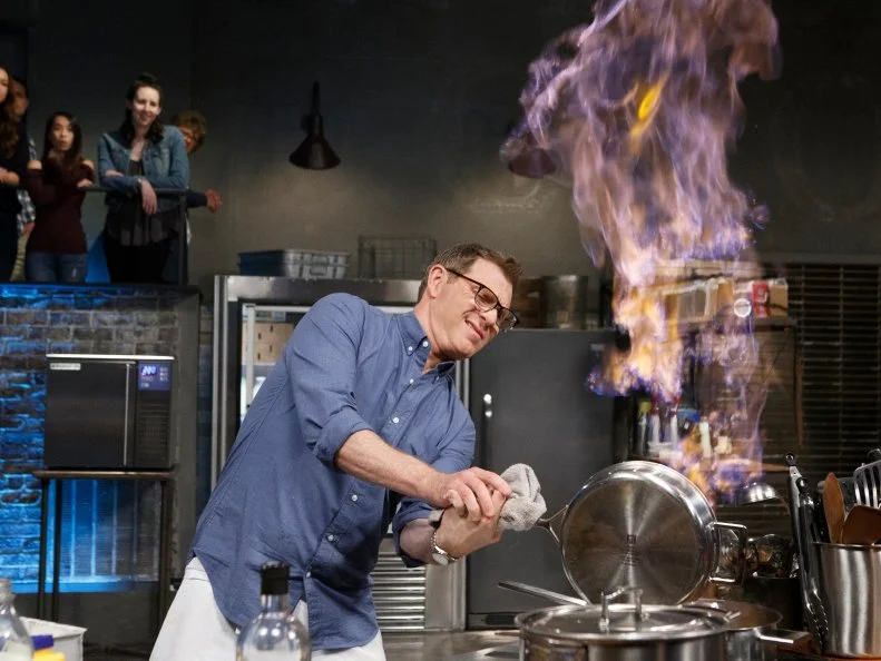 Host Bobby Flay cooks Chicken and Waffles during round two, as seen on Beat Bobby Flay, Season 19.