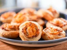 Jeff Mauro makes his Cheddar and Bacon Pinwheels, as seen on The Kitchen, season 30.