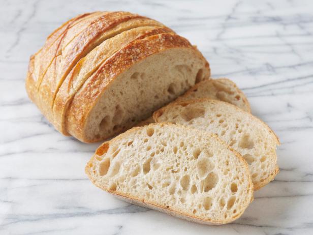 A sliced loaf of San Francisco sourdough bread.