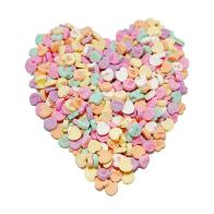 Conversation hearts in the shape of a heart on a white background