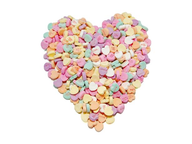 Conversation hearts in the shape of a heart on a white background