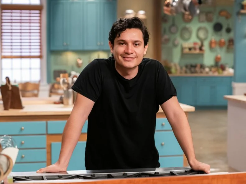 Contestant Fabrizio Villalpando poses behind his station, as seen on Julia Child Challenge, Season 1