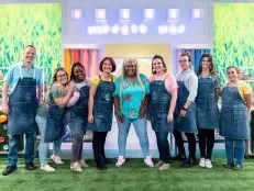 Portrait of host Sunny Anderson with contestants Sean Dwyer, Samantha Terrana, Sydney Perry, Tatiana Kovalenko, Whitney Ronzello, Brandon Ting, Kathleen Faliskie, and Brittany Lombardi, as seen on Spring Baking Championship: Easter Season 2.