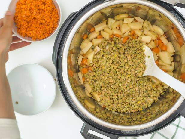 Red lentils, green lentils, and some ingredients close up in a pot. Multi cooker lentil soup recipe
