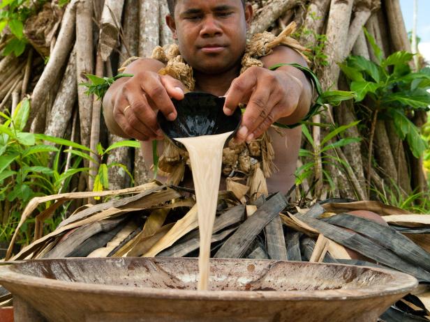 MR Fijian man (age 30) preparing the traditional kava drink in ceremony.
