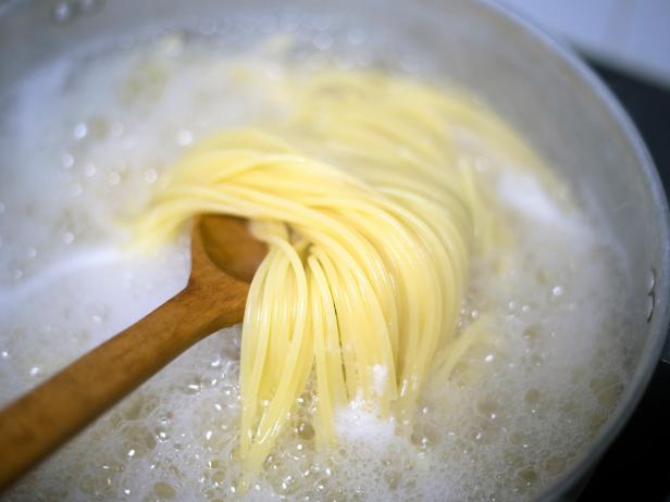 boiled water and spaghetti noodle for cooking italian pasta cuisine