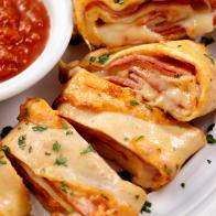 Authentic Hand Made Italian Stromboli with Pepperoni, Ham, Fresh Parmesan and Marinara Sauce  - Photographed on a Hasselblad H3D11-39 megapixel Camera System