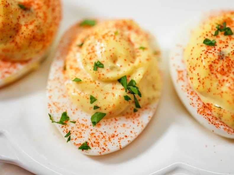 Katie Lee Biegel makes her Lemon Caper Deviled Eggs, as seen on The Kitchen, season 30.