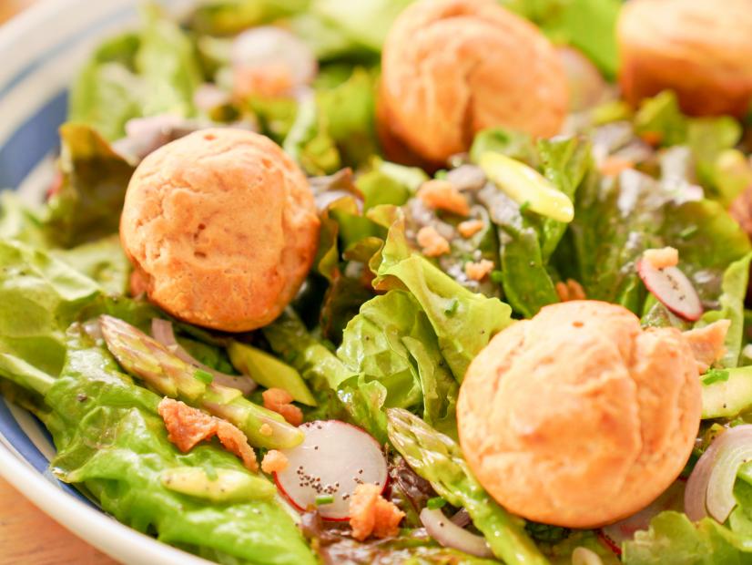 Beauty shot of Molly Yeh's Passover Popover Salad with Honey Poppyseed Dressing, as seen on Girl Meets Farm, season 10.