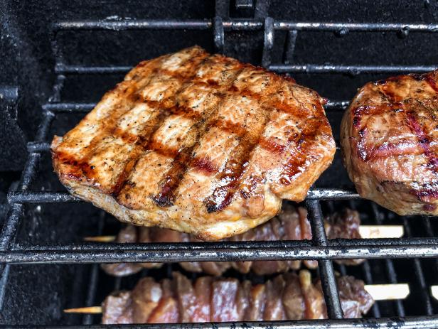 A closeup shot of a grilled pork chop.