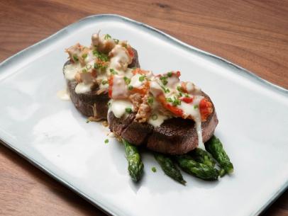 Anne Burrell’s Steak Oscar with King Crab and Asparagus is displayed, as seen on Worst Cooks in America, Season 23.
