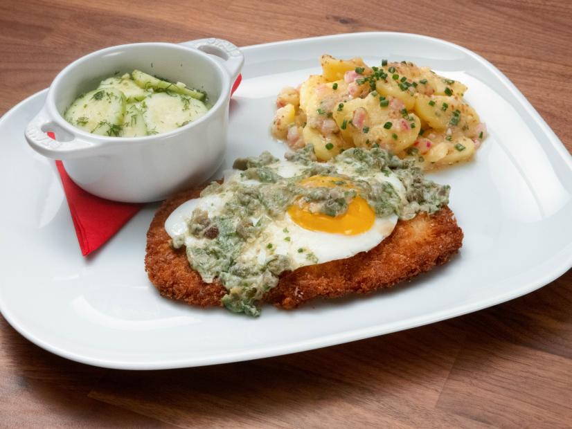 Anne Burrell’s Pork Holstein Schnitzel with Austrian Potato Salad and Pickled Cucumbers is displayed, as seen on Worst Cooks in America, Season 23.