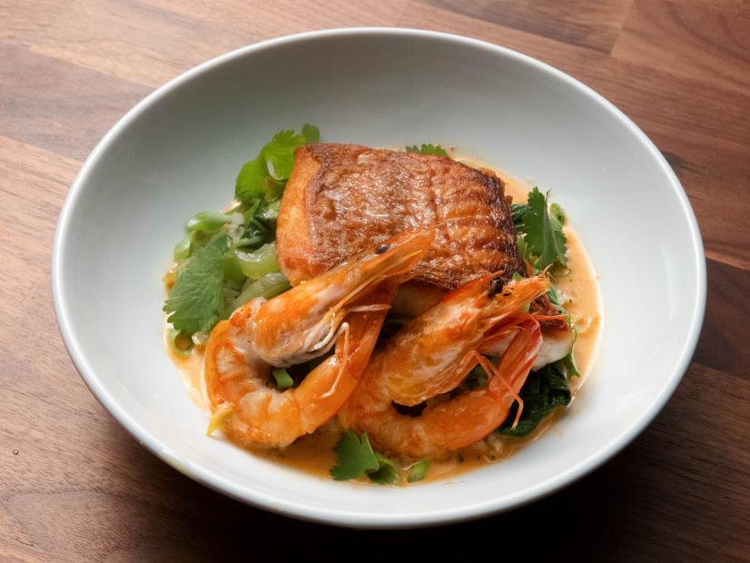 Anne Burrell’s Seared Red Snapper with Shrimp, Sauteed Bok Choy and Red Coconut Curry is displayed, as seen on Worst Cooks in America, Season 23.