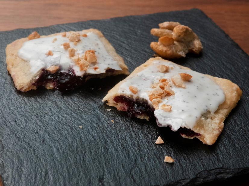 Jeff Mauro’s Blueberry Pastry Pocket with Lemon Poppyseed Glaze and Candied Cashews is displayed, as seen on Worst Cooks in America, Season 23.