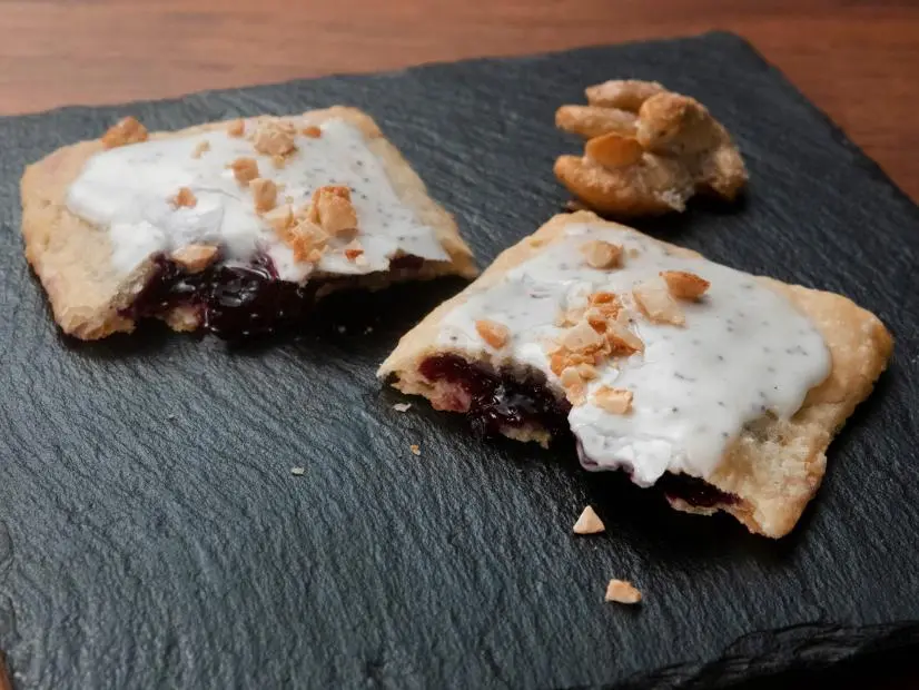 Blueberry Pastry Pocket with Lemon Poppy Seed Glaze and Candied Cashews Recipe Jeff Mauro
