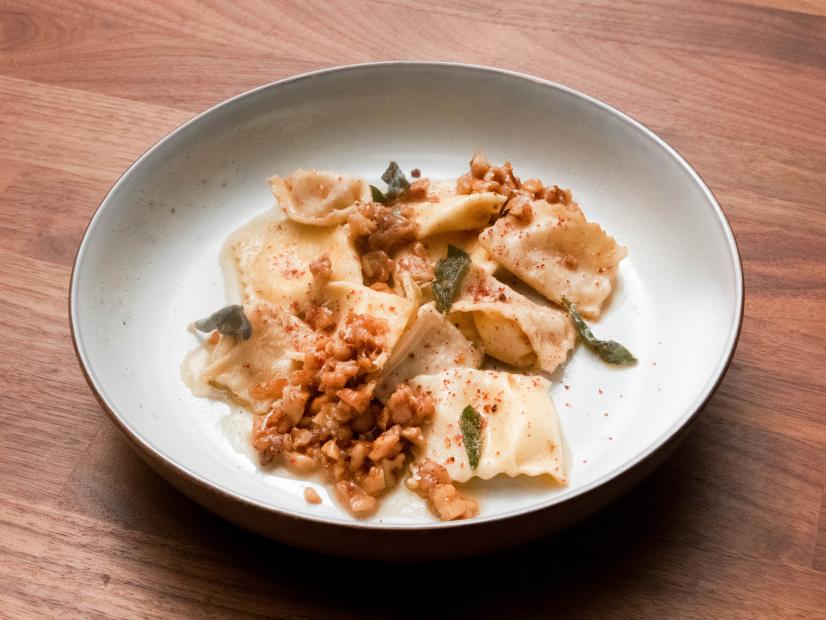 Jeff Mauro’s Gorgonzola Pear Agnolotti with Brown Butter Walnut Sage Sauce is displayed, as seen on Worst Cooks in America, Season 23.