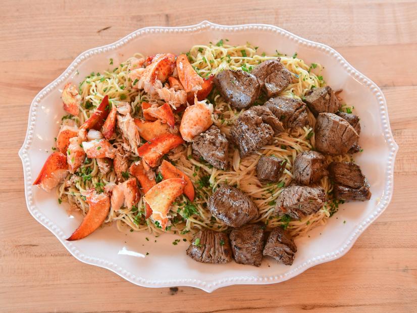 Close-up of Herbed Lemon Pasta with Lobster and Steak Bites, as seen on The Pioneer Woman, season 31.