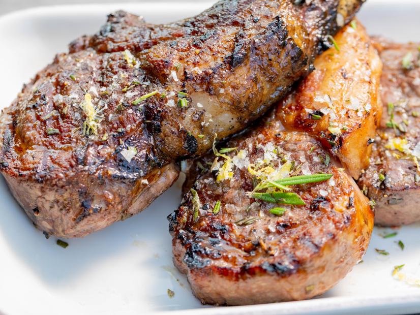 Host Michael Symon's Grilled Lamb Chops with Rosemary Salt, as seen on Symon's Dinners Cooking Out, Season 3.