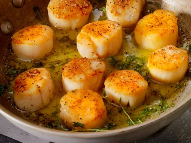 Pan Searing Scallops in Butter, olive oil and fresh garlic and thyme -Photographed on Hasselblad H3D2-39mb Camera