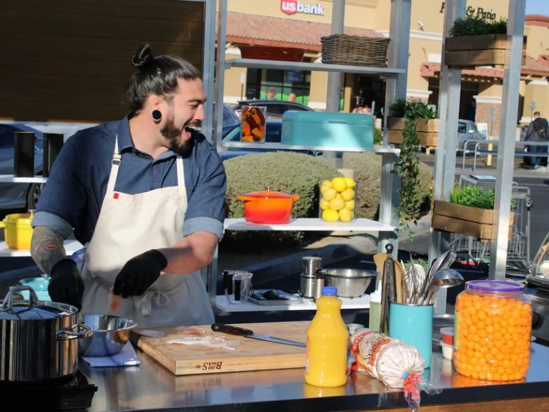 Chef Logan Sandoval cooking, as seen on Supermarket Steakout, season 2.