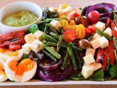 Ree enjoys presenting this salad on a big board, making small piles of the different elements on top of the green leaves. It looks abundant and impressive in the center of a big table, and everyone can help themselves.