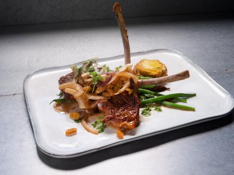Seared Lamb Chops with Roasted Radishes and Haricots Verts, Black Olives, Pine Nuts, Fennel and Scalloped Potato Cake with Goat Cheese and Dill