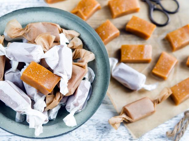 Sweet caramel toffee  caramels on wooden table