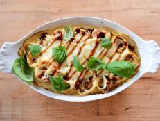 This is a savory pasta dish, so the addition of apricot preserves may seem strange. However, many cuisines combine salty and sweet flavors and are delicious. Though oven-ready lasagna sheets are called for, they still need a brief boil to make them flexible enough to roll.