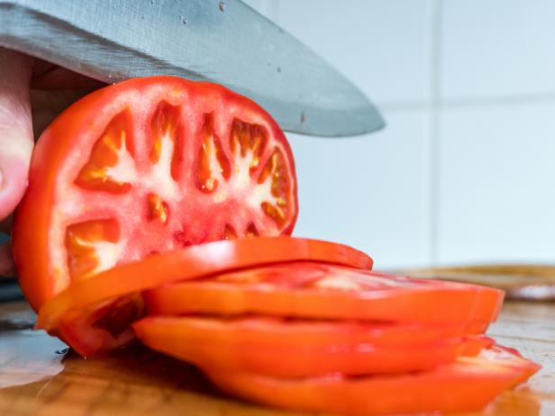 Cutting tomatoes slices, A Coruna, Galicia, Spain