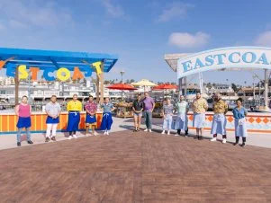 West Coast Contestant Chef's Kaleena, Josh, Jessica, Brian and team leader, Brooke Williamson, Host Antonia Lofaso, Guest Judge Noah Cappe, East Coast Team Leader Tiffani Faison, COntestant Chef's Ben, Jared, Edward and Jada portrait, as seen on Beachside Brawl, Season 1.