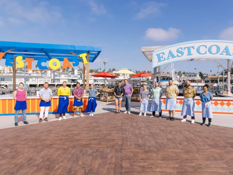 West Coast Contestant Chef's Kaleena, Josh, Jessica, Brian and team leader, Brooke Williamson, Host Antonia Lofaso, Guest Judge Noah Cappe, East Coast Team Leader Tiffani Faison, COntestant Chef's Ben, Jared, Edward and Jada portrait, as seen on Beachside Brawl, Season 1.