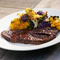Pork Steaks with Cherry Barbecue Sauce and Roasted Cauliflower, as seen on Food Network's Symon's Dinners Cooking Out, Season 3.