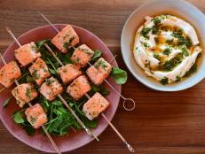 Quick-cooking salmon lets you get dinner on the table in a matter of minutes. Here, Ree cuts the fish into chunks and threads it onto skewers to further speed up the cooking time.