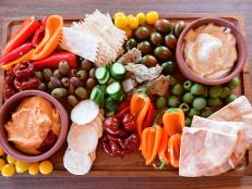 A large platter overflowing with colorful vegetables looks attractive on any buffet table and can be prepared before guests arrive. Using store-bought dips is an easy way to save time.