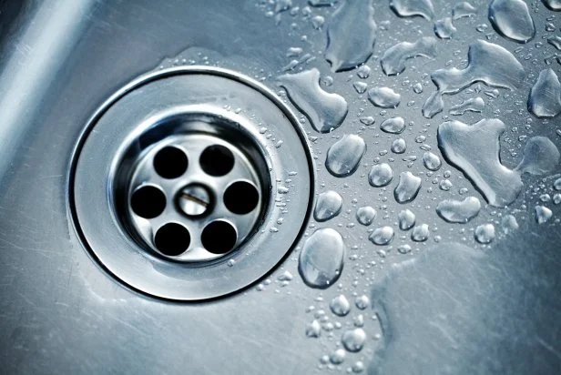 Water Drops Around Plughole,