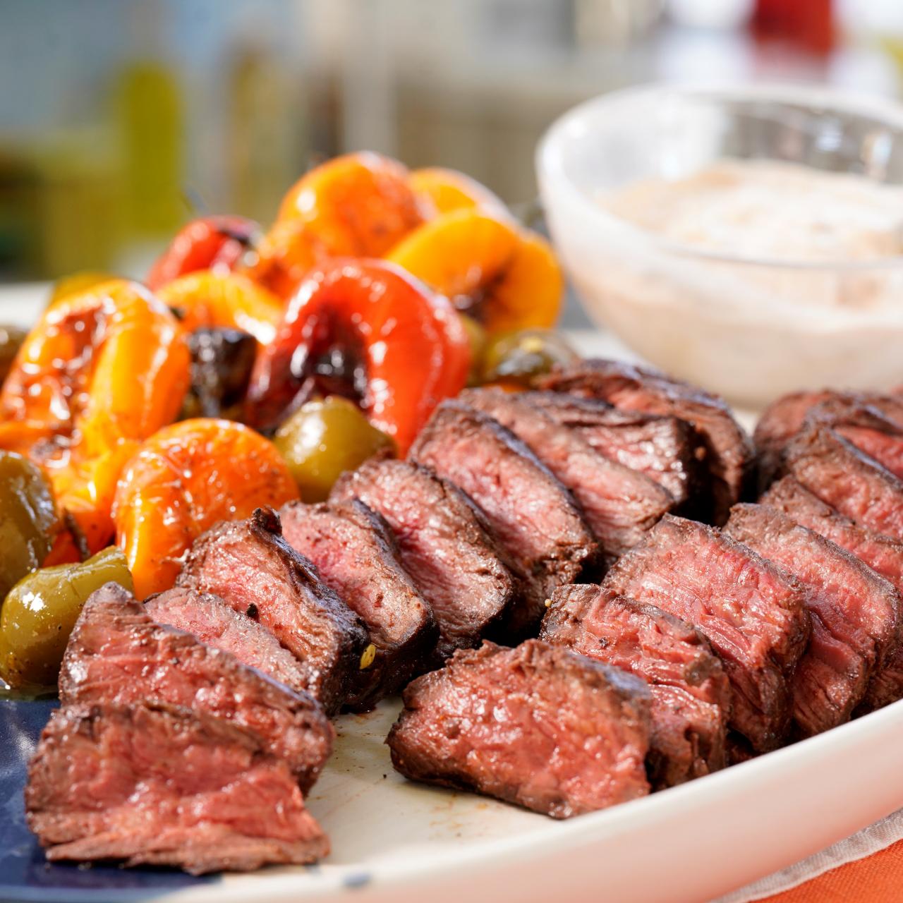 https://food.fnr.sndimg.com/content/dam/images/food/fullset/2022/06/16/KC3103-geoffrey-zakarian-dry-rubbed-hanger-steak-with-smoky-aioli-and-charred-peppers.jpg.rend.hgtvcom.1280.1280.suffix/1655392129085.jpeg