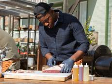 Contender Rashad Jones cleans up the sirloin cap for his Advantage Challenge dish, as seen on BBQ Brawl, Season 3.