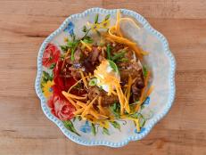 Ree uses a bag of shredded hash browns to make these over-the-top potato pancakes. You can use frozen or refrigerated hash browns, although Ree prefers the ones that are refrigerated.