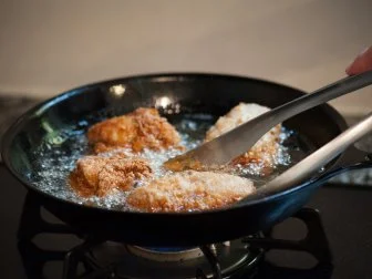 Preparing fried chicken