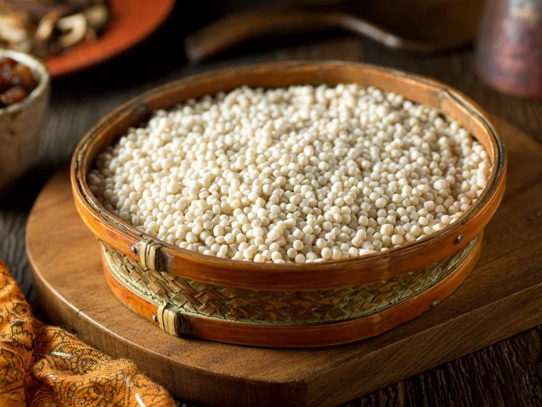 A bowl of raw organic Israeli couscous.