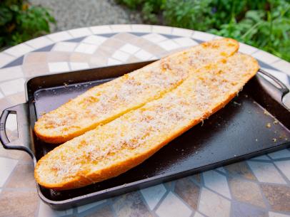Host Michael Symon's Roasted Garlic Bread, as seen on Symon's Dinners Cooking Out, Season 3.