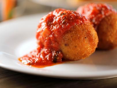 Arancini as served at Real Italian Deli in Palm Desert, California, as seen on Diners, Drive-Ins and Dives, season 35.