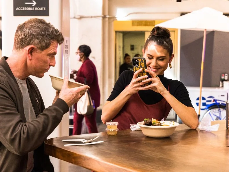 Host Bobby and Sophie Flay sample the Chicken Adobo, Sari sari Hot Chicken Wings, Ube and coconut milkshake, and Pinoy BBQ Ribs at the Sari Sari Store in Grand Central Market in downtown Los Angeles, as seen on Bobby and Sophie Take the Coast, Season 1.