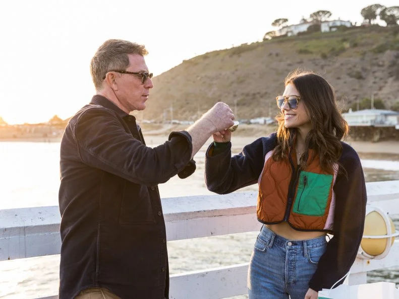 Host Bobby and Sophie Flay eat their meal from Broad Street Oysters on the Malibu Pier in Malibu, CA, as seen on Bobby and Sophie Take the Coast, Season 1.