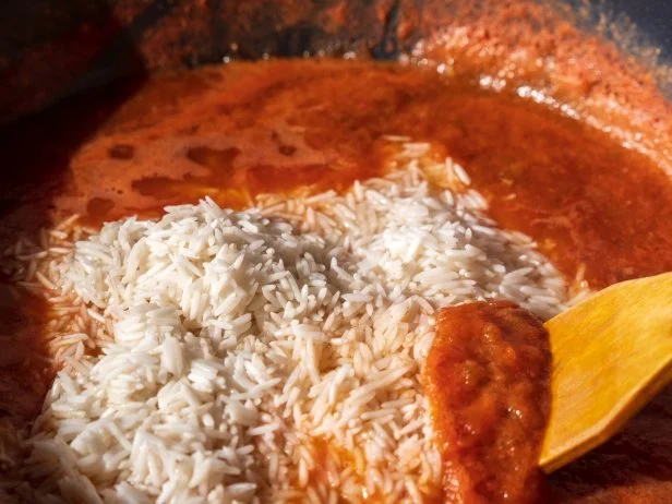Jollof rice, west african cuisine. West African countries, cooking food. Selective focus