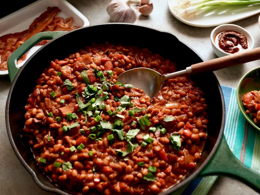 Beauty shot of Molly Yeh's Saucy Stovetop Bacon Beans, as seen on Girl Meets Farm, season 11.
